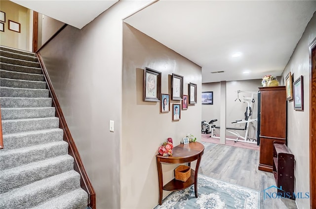 stairs with wood-type flooring