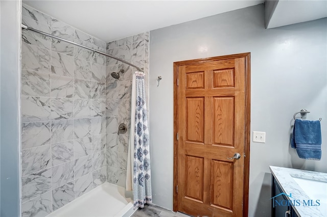 bathroom with vanity and curtained shower