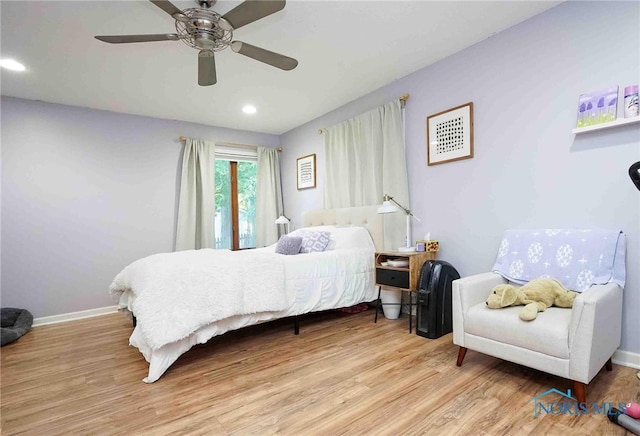 bedroom featuring light hardwood / wood-style flooring and ceiling fan