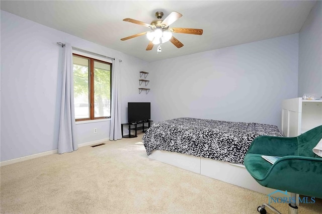 carpeted bedroom with ceiling fan