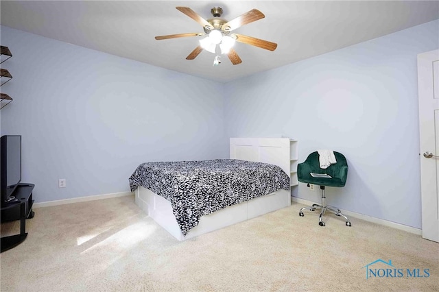 bedroom with ceiling fan and light carpet