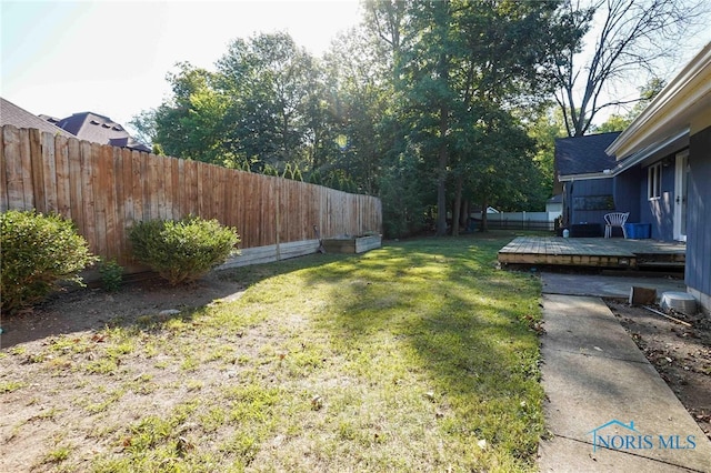 view of yard with a deck