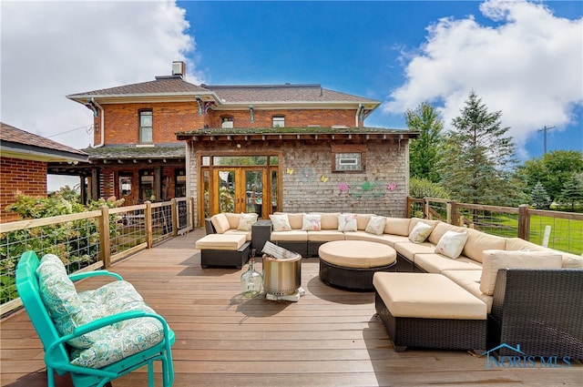 wooden deck with an outdoor hangout area