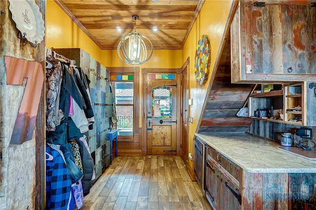 mudroom featuring light wood-type flooring, wood ceiling, and crown molding