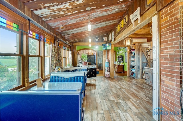 unfurnished sunroom with vaulted ceiling