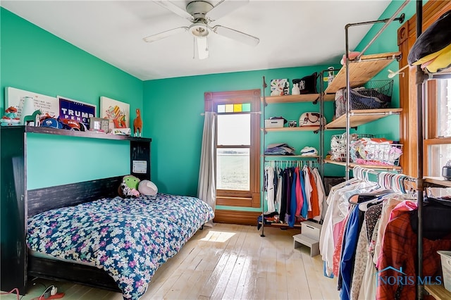 bedroom featuring light wood-type flooring and ceiling fan