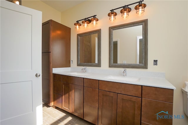 bathroom featuring tile patterned floors and vanity