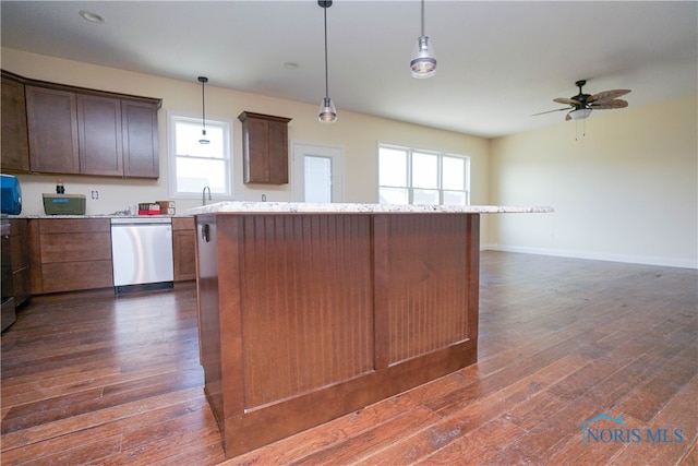 kitchen featuring dishwasher, dark hardwood / wood-style flooring, and a healthy amount of sunlight