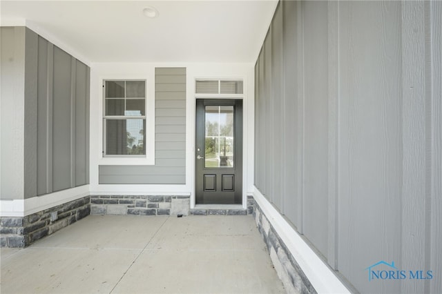 property entrance with a patio