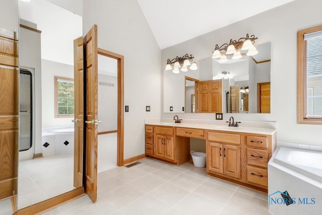 bathroom featuring vanity, vaulted ceiling, separate shower and tub, and tile patterned floors