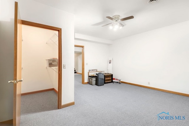 interior space with a closet, ceiling fan, and a spacious closet