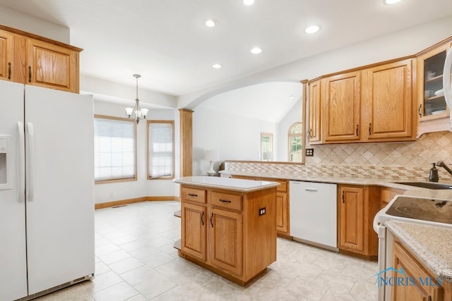 kitchen with an inviting chandelier, white appliances, backsplash, hanging light fixtures, and lofted ceiling