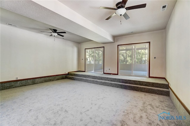 spare room with carpet flooring and ceiling fan