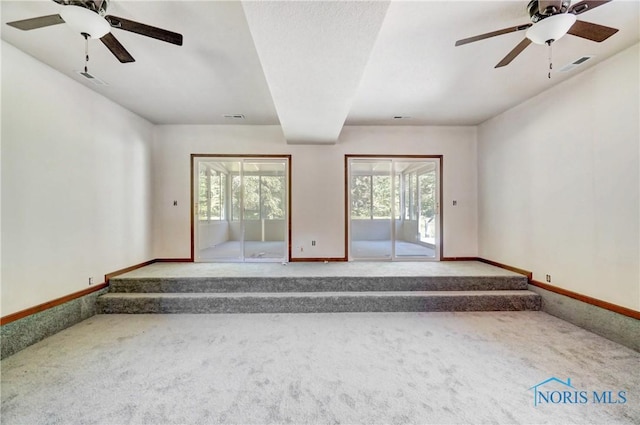 9740 Maumee Western Rd, Monclova, OH 43542 - unfurnished living room with visible vents, baseboards, and carpet flooring