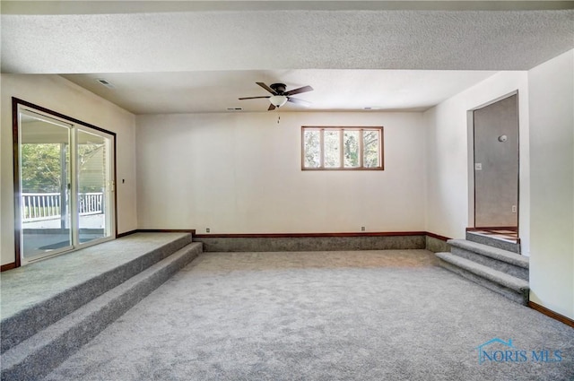 9740 Maumee Western Rd, Monclova, OH 43542 - empty room with a textured ceiling, baseboards, and carpet floors
