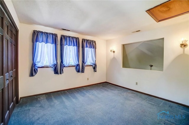 9740 Maumee Western Rd, Monclova, OH 43542 - unfurnished room featuring dark carpet, visible vents, and baseboards