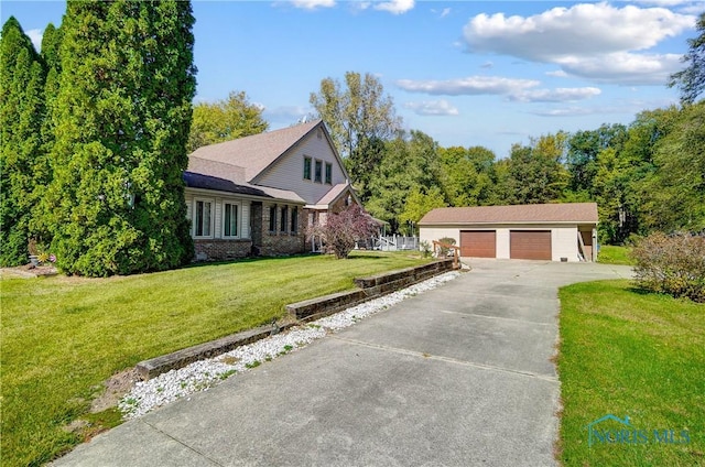 9740 Maumee Western Rd, Monclova, OH 43542 - view of front of property featuring brick siding, a front lawn, an outdoor structure, and a garage