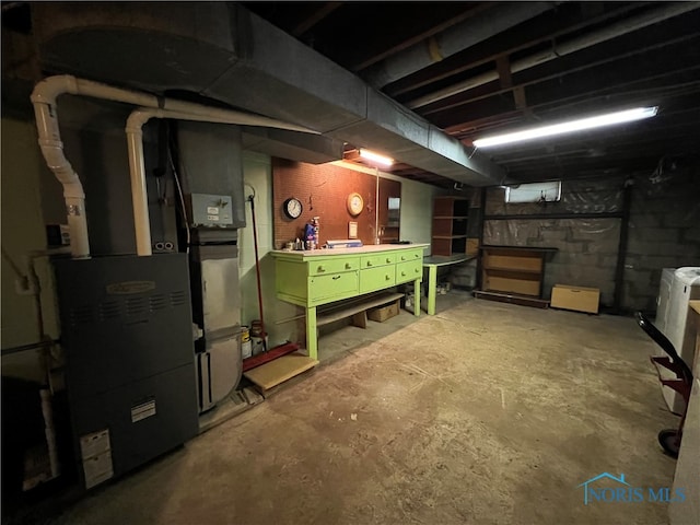 basement featuring heating unit