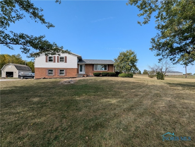 tri-level home with a front lawn and a garage