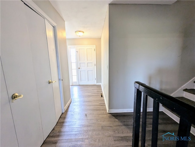 hallway with wood-type flooring