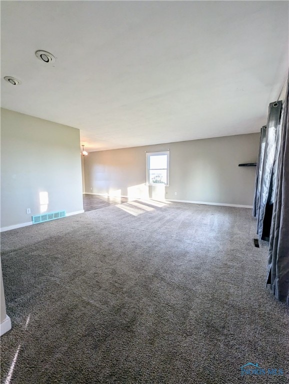 unfurnished living room with carpet floors