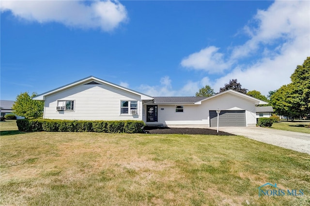 ranch-style house with cooling unit, a garage, and a front lawn