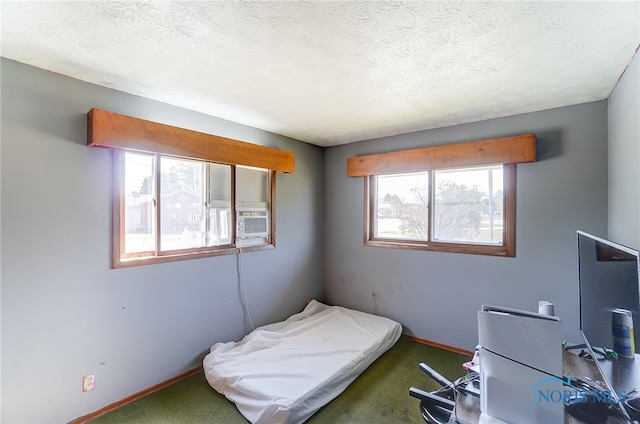 carpeted bedroom featuring a textured ceiling