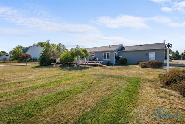 exterior space with a yard and a deck