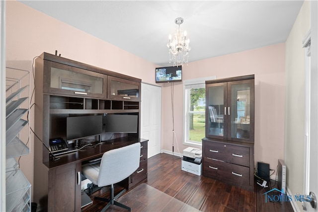 office area featuring a chandelier and dark wood-type flooring