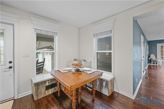 dining room with dark wood-type flooring