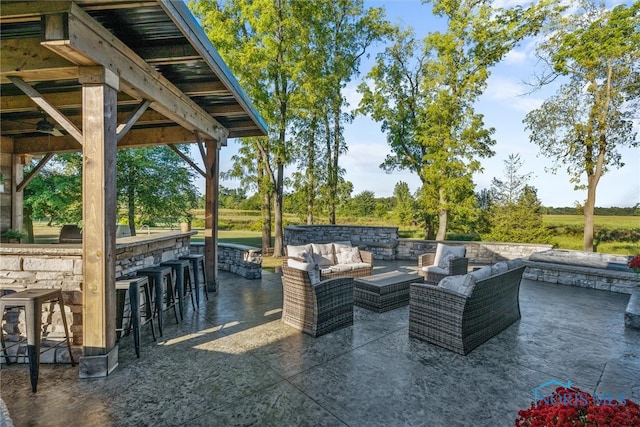 view of patio featuring an outdoor bar and an outdoor hangout area