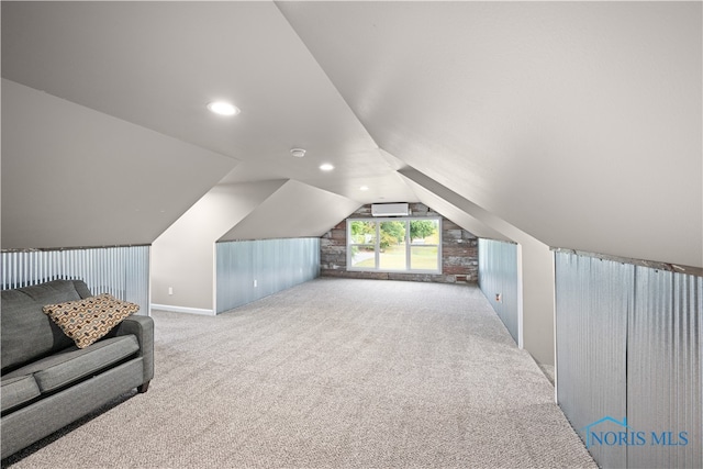 bonus room featuring light carpet, vaulted ceiling, and a wall mounted AC