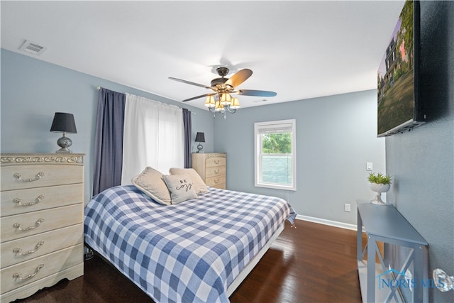 bedroom featuring ceiling fan and dark hardwood / wood-style flooring