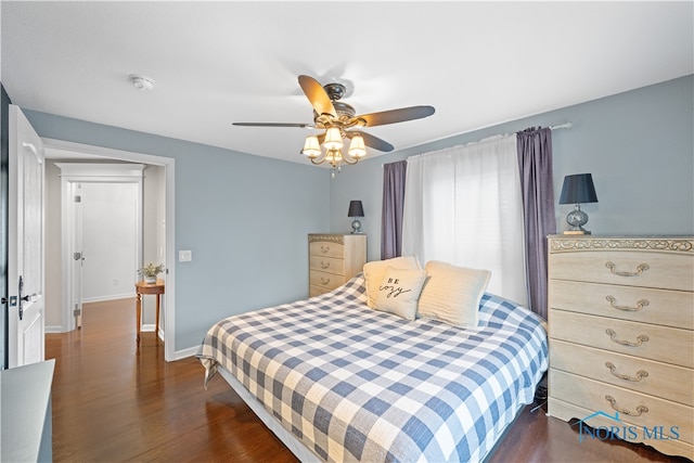 bedroom featuring ceiling fan and dark wood-type flooring