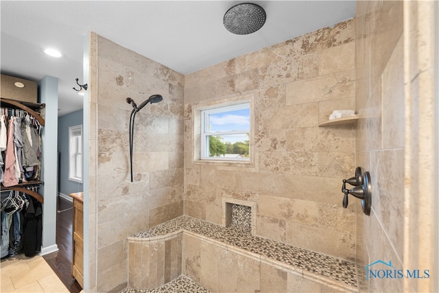 bathroom with a tile shower