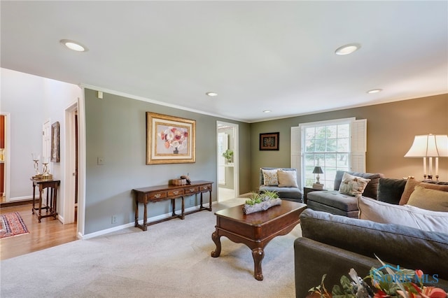 carpeted living room with crown molding