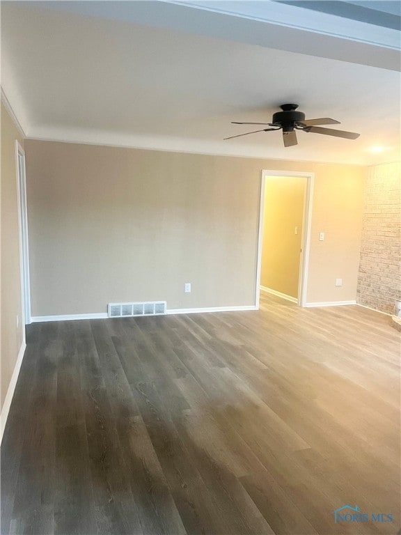 empty room featuring ceiling fan and hardwood / wood-style floors