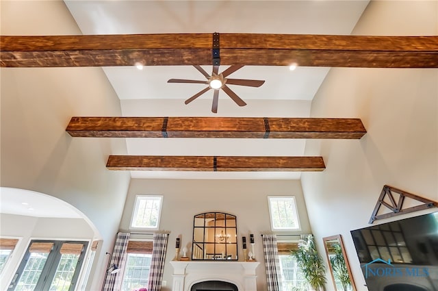 room details featuring ceiling fan and beam ceiling