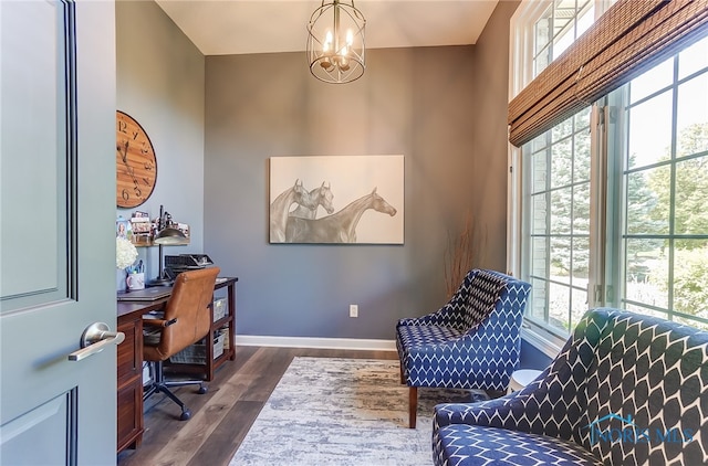 office area featuring a wealth of natural light, a notable chandelier, and dark hardwood / wood-style floors