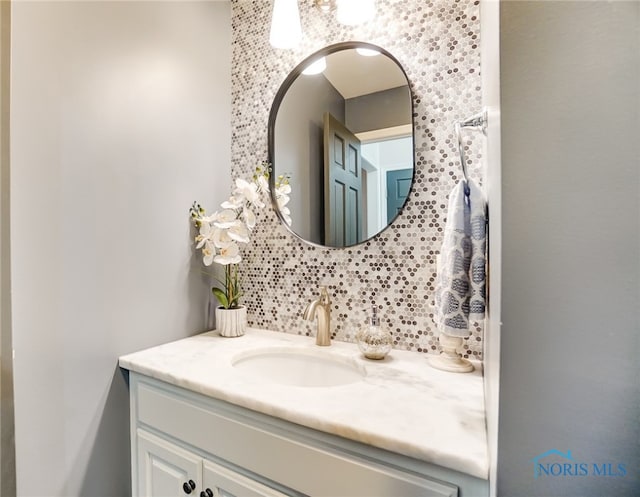 bathroom with backsplash and vanity