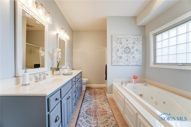 full bathroom with tile patterned flooring, vanity, toilet, and separate shower and tub