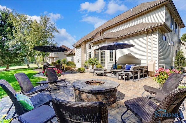 view of patio / terrace featuring an outdoor fire pit