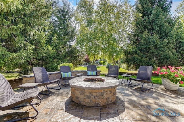 view of patio / terrace featuring a fire pit