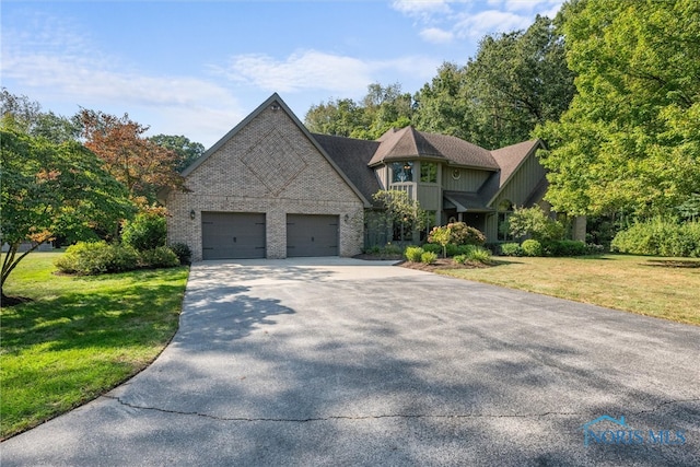 view of front facade with a front lawn and a garage