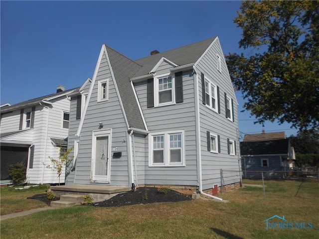 view of front of property with a front lawn