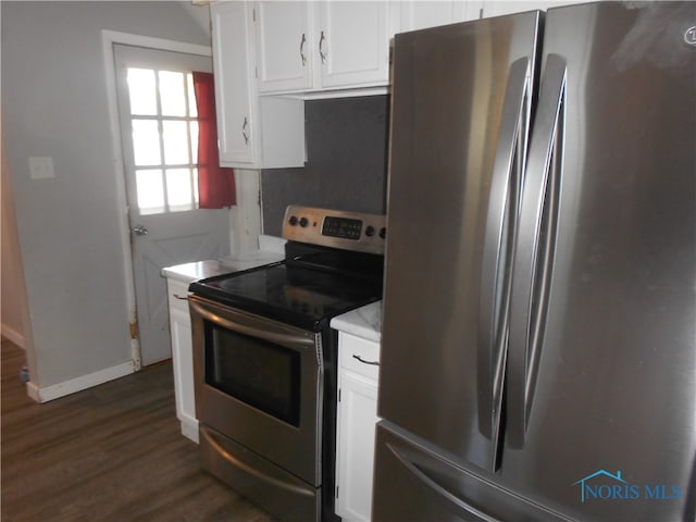 kitchen featuring white cabinetry, appliances with stainless steel finishes, and dark hardwood / wood-style floors