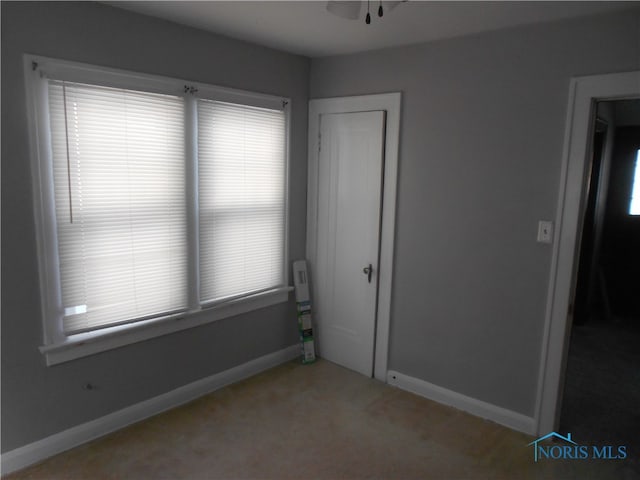 unfurnished bedroom with light carpet