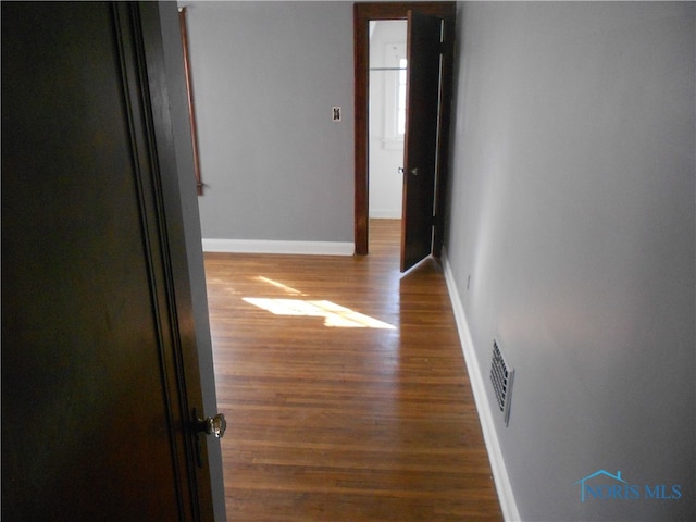 hall featuring dark wood-type flooring