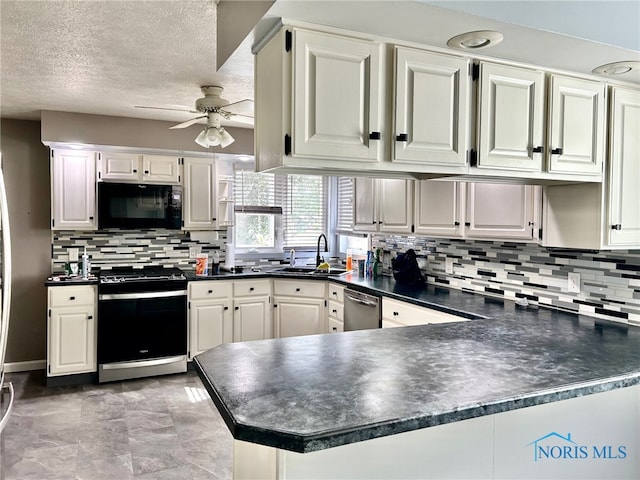 kitchen with ceiling fan, white cabinets, sink, kitchen peninsula, and stainless steel appliances