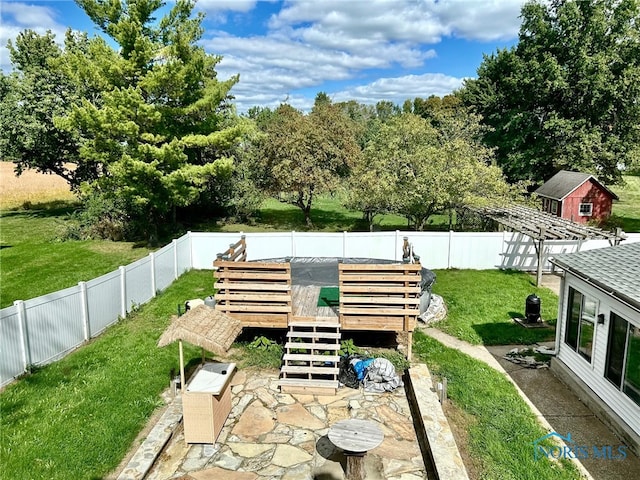 exterior space featuring a storage unit and a patio area